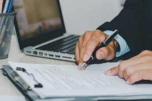 Attorney reviewing records and photographs after a fatal accident in Washington